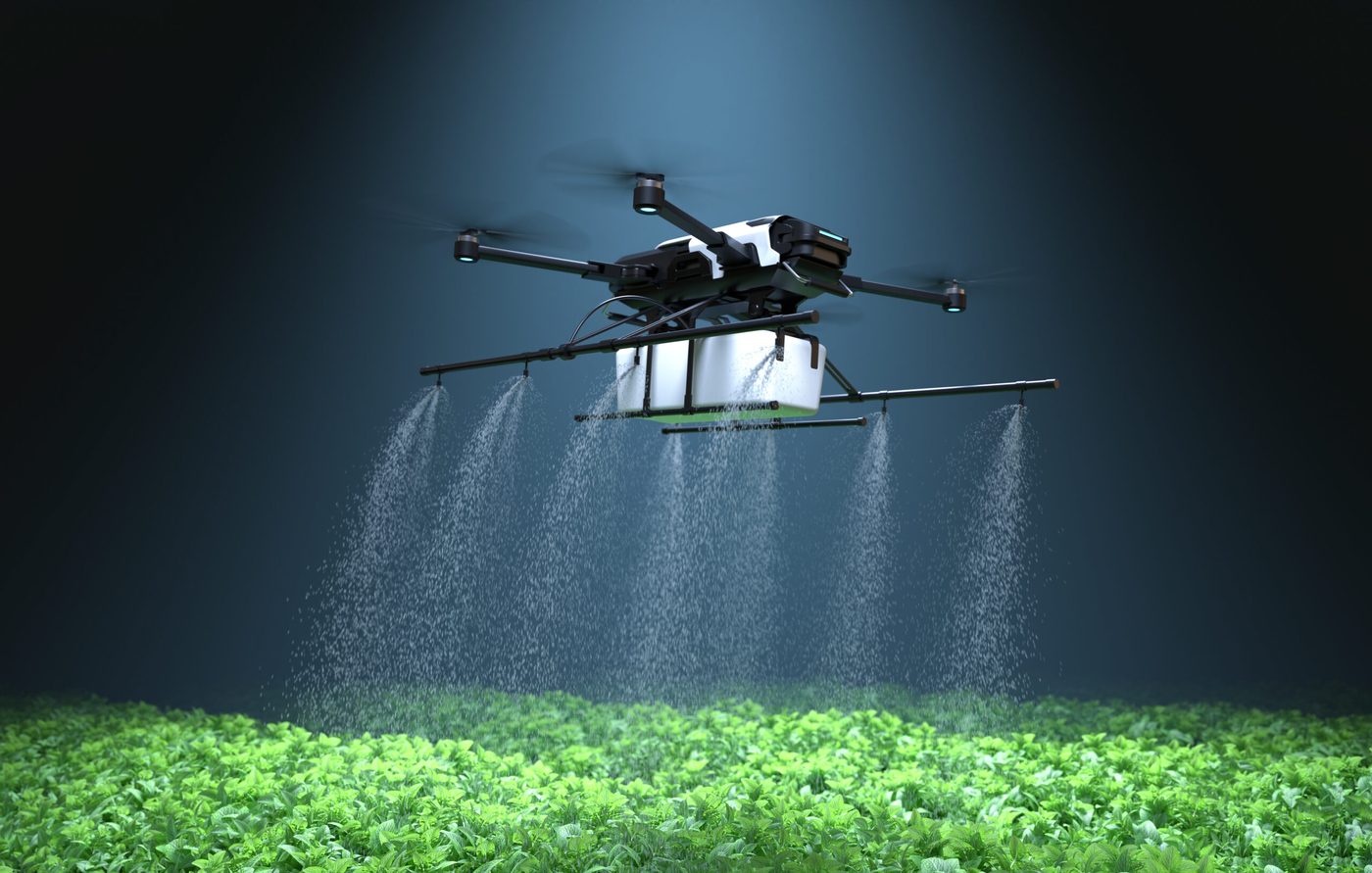 An AgView360 drone spraying over a vegetable crop